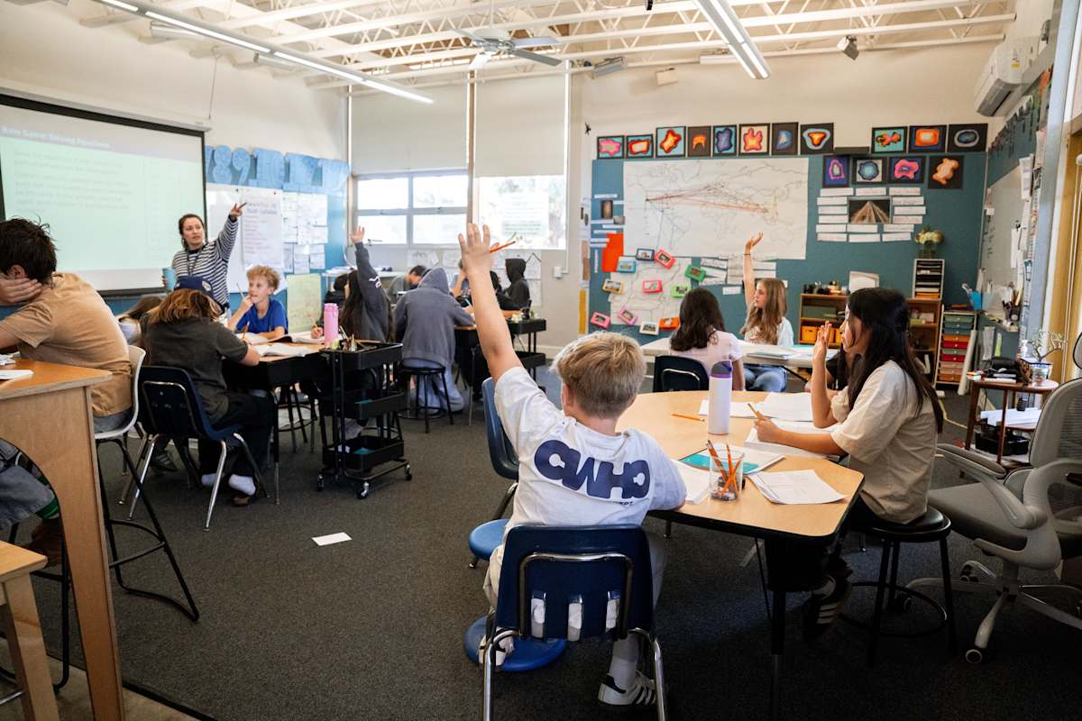 A PS1 teacher working through a problem with students